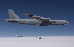 A B-52 bomber releases a Massive Ordnance Penetrator, a 30,000-pound bunker buster bomb
