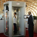 A man inside a full-body scanner being trialled at Charles-de-Gaulle airport
