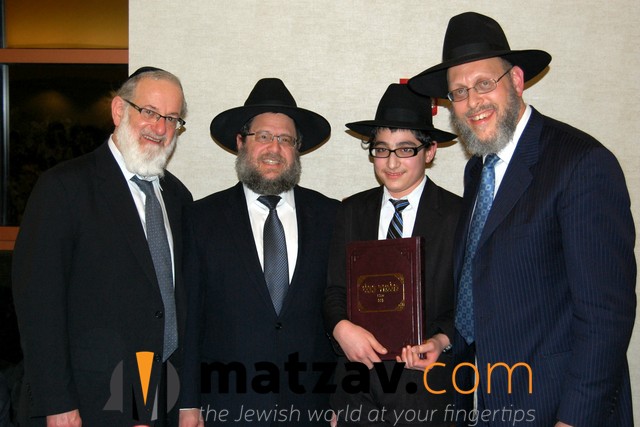 Rabbi Moshe Berger, Rabbi Ephraim Levi and Rabbi Hillel Drazin presenting awards