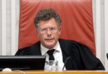 Shas Blasts Supreme Court Chief Over ‘Two Phones’ Remark: ‘Brazen Mockery’ of Chareidi Public