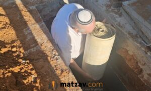 Burned Sifrei Torah Brought to Kevurah Following Deadly Beit Shemesh Missile Strike